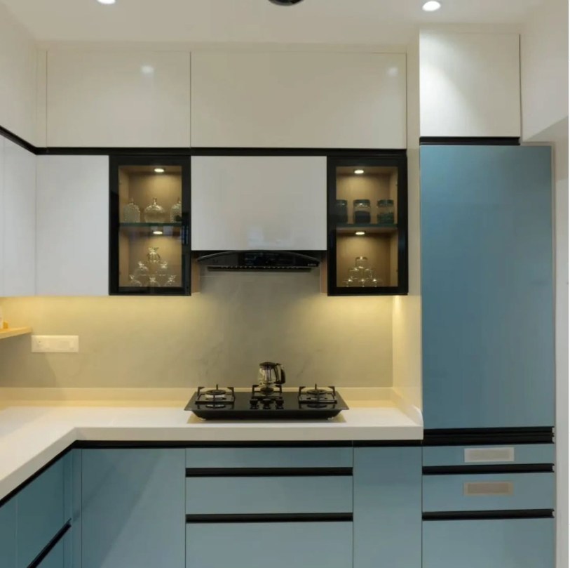 Illuminated glass cabinetry kitchen by Sharma Furniture
