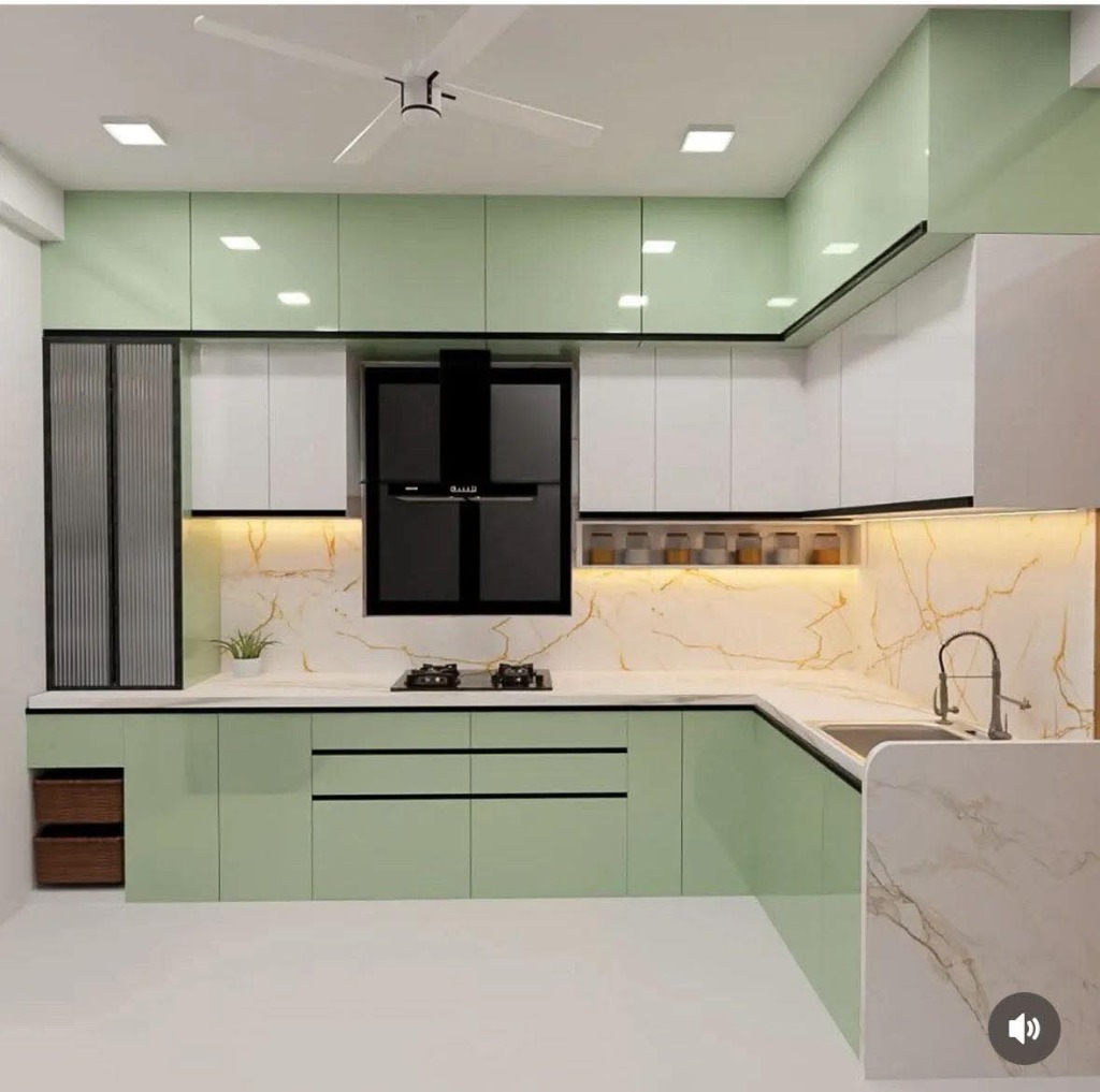 Mint green acrylic modular kitchen with marble waterfall island by Sharma Furniture