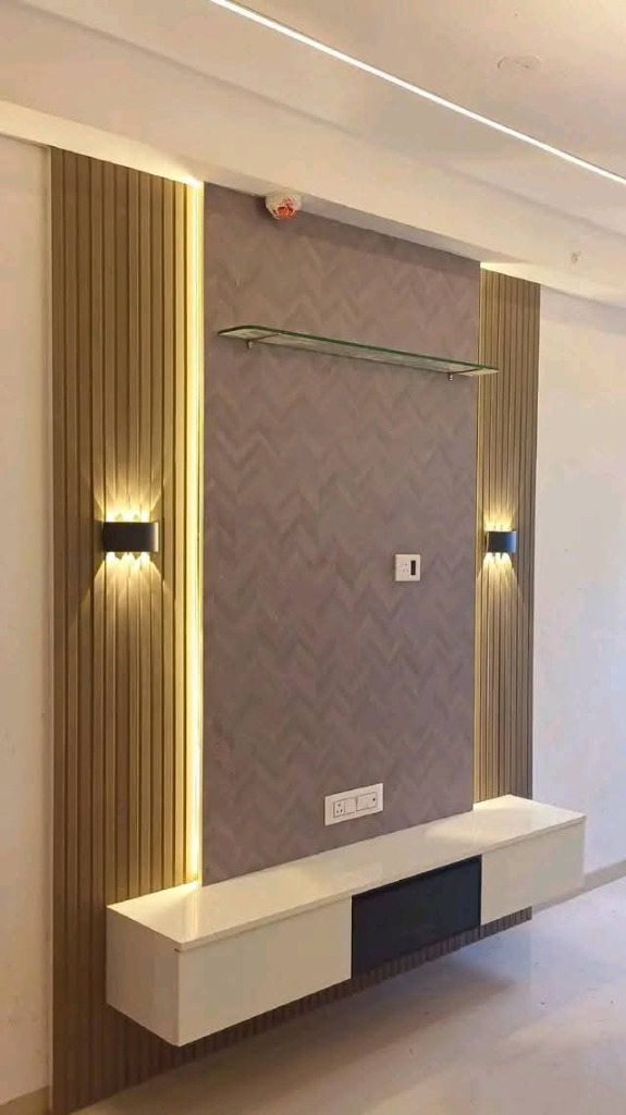 Fluted TV wall with sconce lighting and floating console by Sharma Furniture