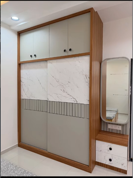 Marble finish sliding wardrobe with vanity by Sharma Furniture